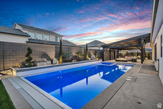 1597 W Belayer Dr, St George, UT 84770 - pool at dusk featuring outdoor lounge area, a fenced backyard, a patio, and a gazebo