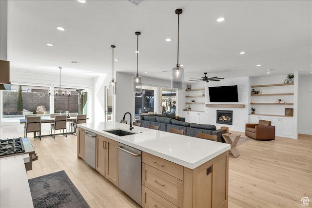 1597 W Belayer Dr, St George, UT 84770 - kitchen featuring stainless steel dishwasher, light brown cabinetry, ceiling fan, light wood-style floors, and recessed lighting