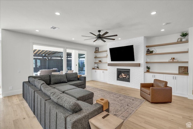 1597 W Belayer Dr, St George, UT 84770 - living area featuring a ceiling fan, light wood-style floors, a fireplace, and recessed lighting