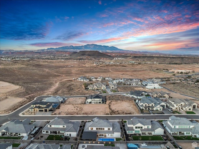 1597 W Belayer Dr, St George, UT 84770 - aerial view at dusk of a residential view and a mountain view