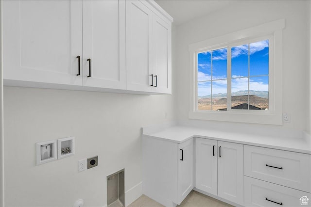 1597 W Belayer Dr, St George, UT 84770 - laundry room with electric dryer hookup, cabinet space, and washer hookup