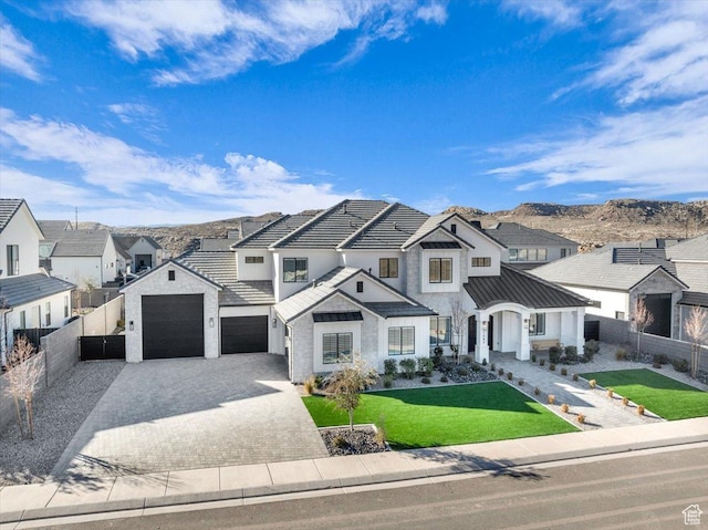 1597 W Belayer Dr, St George, UT 84770 - modern farmhouse style home featuring decorative driveway, a residential view, a standing seam roof, and a metal roof