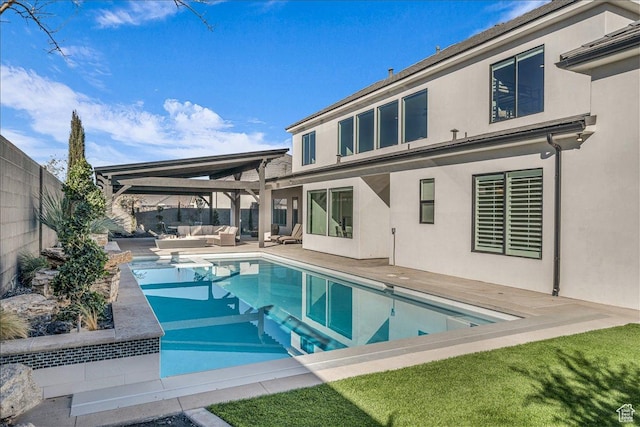 1597 W Belayer Dr, St George, UT 84770 - rear view of property with outdoor lounge area, stucco siding, a fenced backyard, and a patio