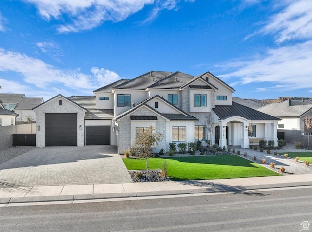 1597 W Belayer Dr, St George, UT 84770 - modern farmhouse style home with decorative driveway, a standing seam roof, stone siding, a garage, and a metal roof