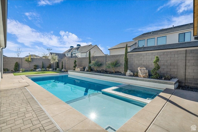 1597 W Belayer Dr, St George, UT 84770 - view of swimming pool featuring a pool with connected hot tub, a fenced backyard, and a patio area