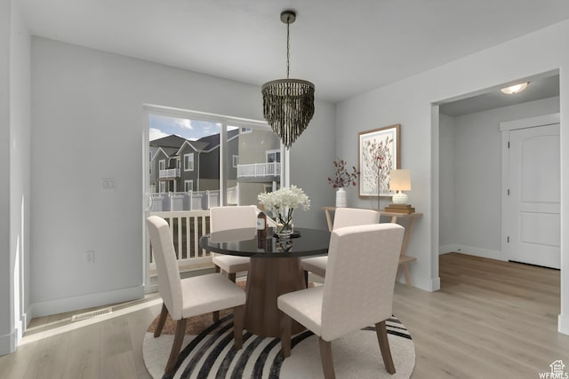 4273 W Watchmen Way, Herriman, UT 84096 - dining room featuring light wood-style flooring and a chandelier