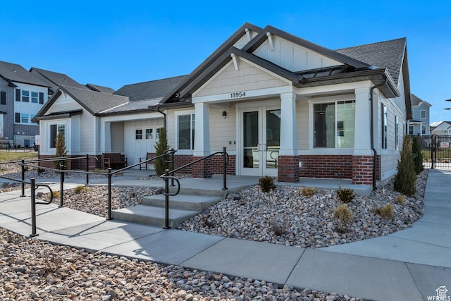 4273 W Watchmen Way, Herriman, UT 84096 - craftsman house featuring french doors, roof with shingles, brick siding, and board and batten siding