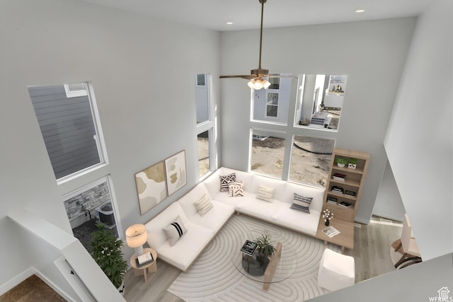 4273 W Watchmen Way, Herriman, UT 84096 - living area with wood finished floors, a high ceiling, ceiling fan, and recessed lighting