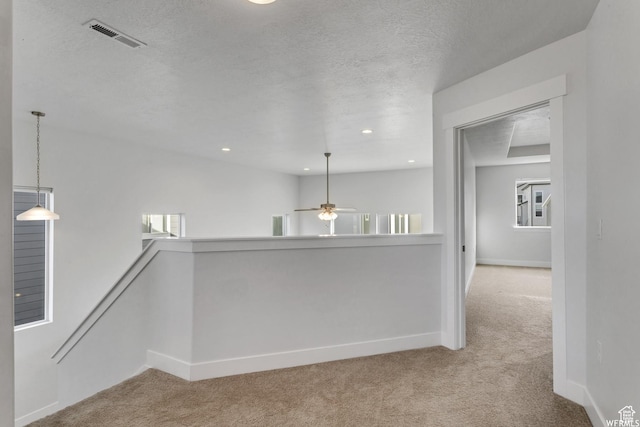 4273 W Watchmen Way, Herriman, UT 84096 - corridor with carpet, an upstairs landing, a textured ceiling, and recessed lighting