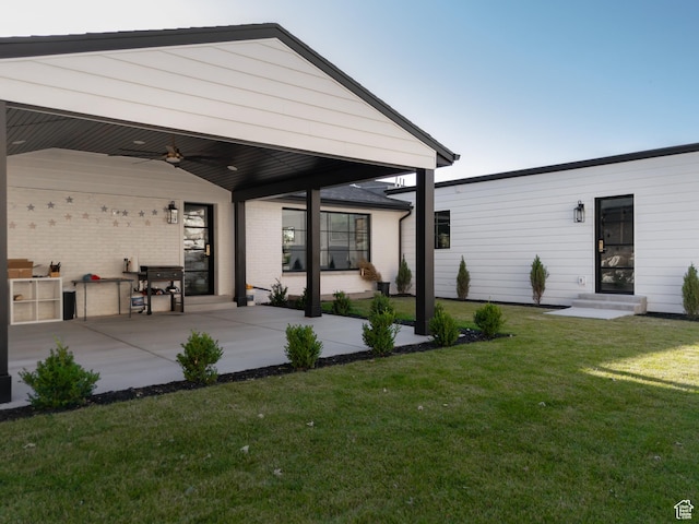4605 S Ledgemont Dr E, Salt Lake City, UT 84124 - rear view of house with ceiling fan, a yard, and a patio