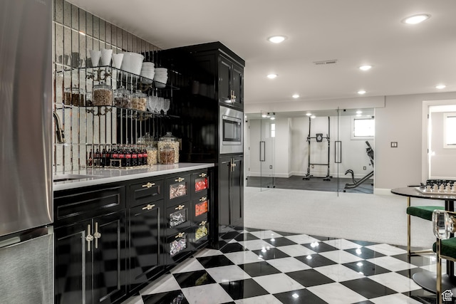 4605 S Ledgemont Dr E, Salt Lake City, UT 84124 - indoor dry bar with freestanding refrigerator, dark carpet, recessed lighting, and oven