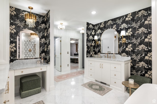 4605 S Ledgemont Dr E, Salt Lake City, UT 84124 - bathroom with vanity, marble tiled flooring, a freestanding bath, wallpapered walls, and a chandelier