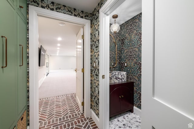 4605 S Ledgemont Dr E, Salt Lake City, UT 84124 - bathroom featuring wallpapered walls, brick patterned floors, and vanity