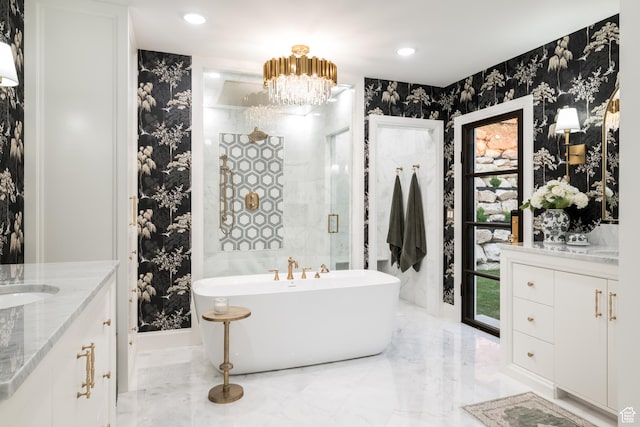 4605 S Ledgemont Dr E, Salt Lake City, UT 84124 - bathroom with marble tiled flooring, vanity, a freestanding tub, a chandelier, and wallpapered walls