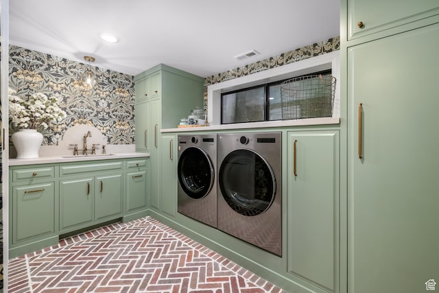4605 S Ledgemont Dr E, Salt Lake City, UT 84124 - laundry area with washing machine and clothes dryer, cabinet space, wallpapered walls, and brick patterned floors