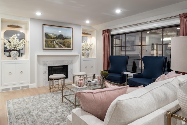 4605 S Ledgemont Dr E, Salt Lake City, UT 84124 - living area featuring wood finished floors, a premium fireplace, and recessed lighting
