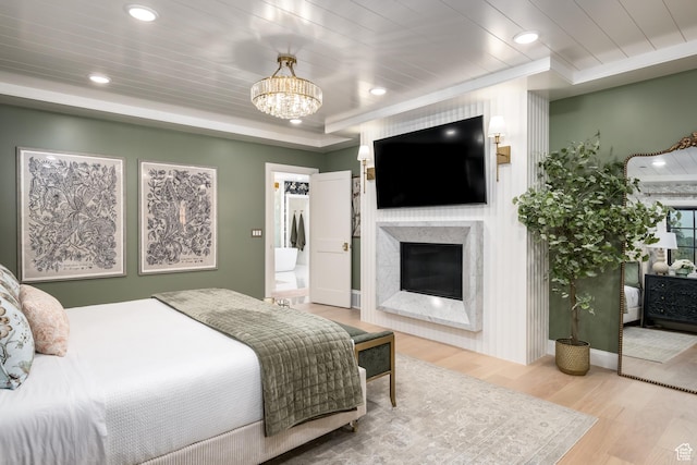 4605 S Ledgemont Dr E, Salt Lake City, UT 84124 - bedroom with wood finished floors, a high end fireplace, a chandelier, recessed lighting, and ornamental molding