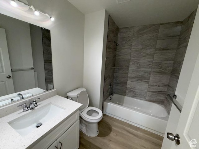 445 E Fort Union Blvd, Midvale, UT 84047 - bathroom featuring wood finished floors, vanity, and bathing tub / shower combination