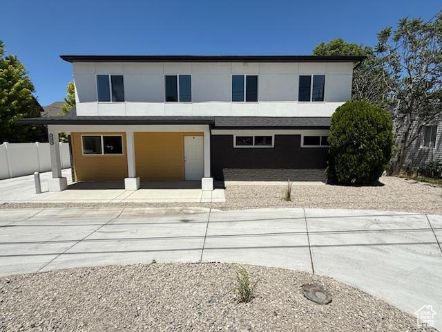 445 E Fort Union Blvd, Midvale, UT 84047 - modern home featuring a porch and stucco siding