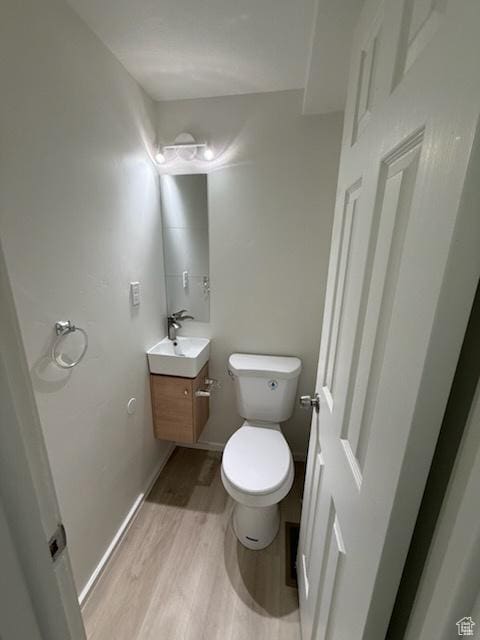 445 E Fort Union Blvd, Midvale, UT 84047 - bathroom featuring vanity and wood finished floors