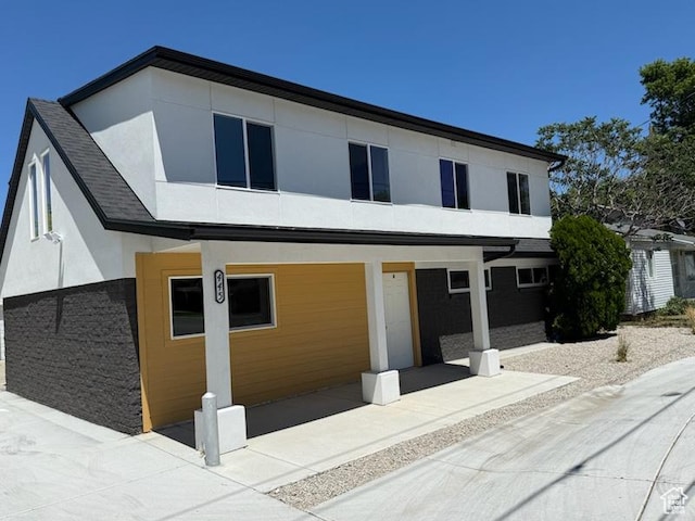 445 E Fort Union Blvd, Midvale, UT 84047 - contemporary house featuring stucco siding and covered porch