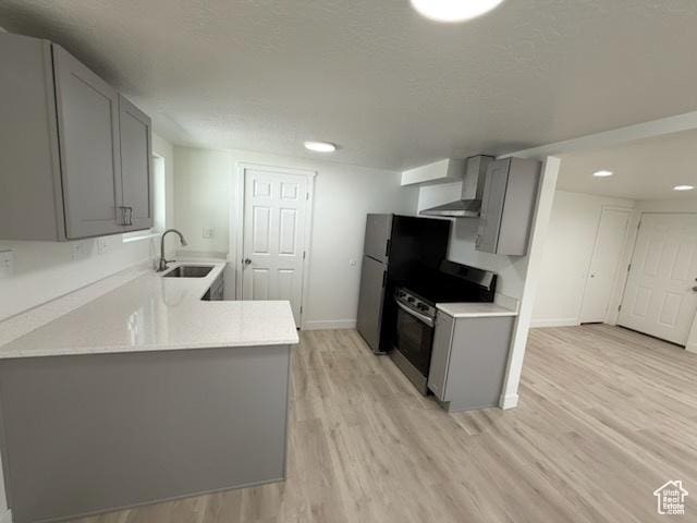 445 E Fort Union Blvd, Midvale, UT 84047 - kitchen with gray cabinetry, electric range, wall chimney exhaust hood, light countertops, and a textured ceiling