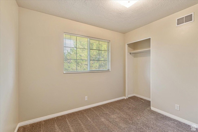 1218 W 1420 N, Orem, UT 84057 - unfurnished bedroom with carpet flooring, a closet, and a textured ceiling