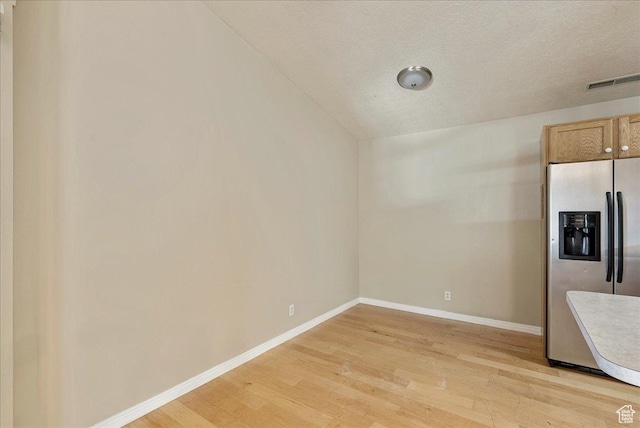 1218 W 1420 N, Orem, UT 84057 - unfurnished dining area with light wood finished floors and a textured ceiling