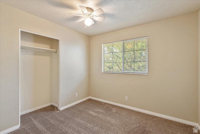1218 W 1420 N, Orem, UT 84057 - unfurnished bedroom with carpet flooring, a closet, a textured ceiling, and a ceiling fan
