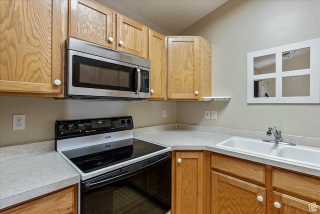 1218 W 1420 N, Orem, UT 84057 - kitchen with black range with electric stovetop, stainless steel microwave, and light countertops