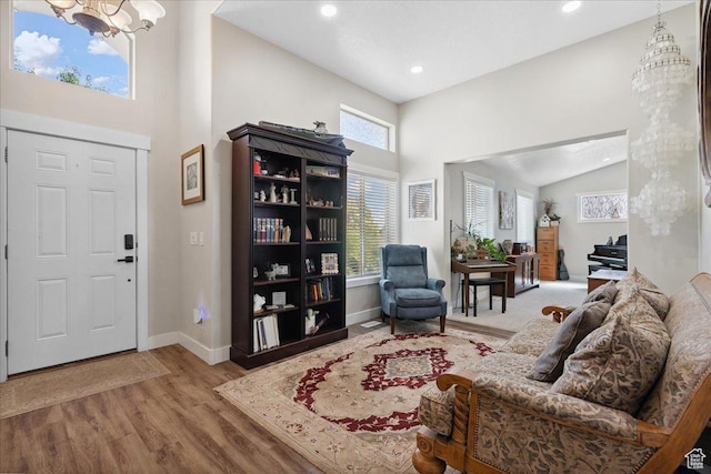 5719 W Boulder Creek Rd, West Jordan, UT 84081 - foyer featuring a chandelier, wood finished floors, high vaulted ceiling, and recessed lighting