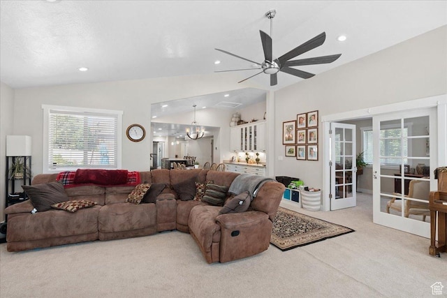 5719 W Boulder Creek Rd, West Jordan, UT 84081 - carpeted living area with vaulted ceiling, plenty of natural light, french doors, ceiling fan, and a chandelier