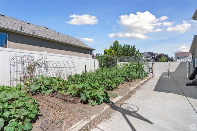 5719 W Boulder Creek Rd, West Jordan, UT 84081 - fenced backyard featuring a garden and a patio area