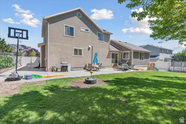 5719 W Boulder Creek Rd, West Jordan, UT 84081 - back of house with a patio, a fenced backyard, stucco siding, and a playground