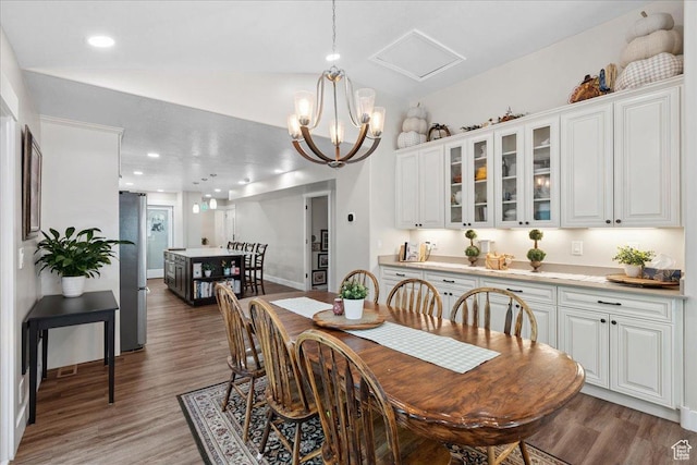 5719 W Boulder Creek Rd, West Jordan, UT 84081 - dining space with wood finished floors, vaulted ceiling, a chandelier, and recessed lighting