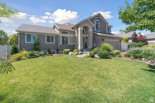 5719 W Boulder Creek Rd, West Jordan, UT 84081 - view of front of home featuring stone siding, board and batten siding, and a garage