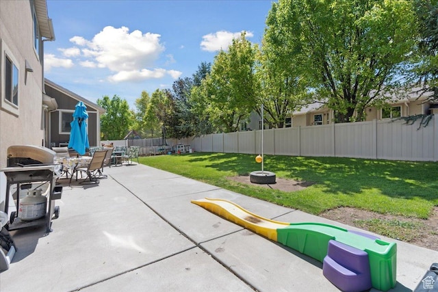 5719 W Boulder Creek Rd, West Jordan, UT 84081 - fenced backyard featuring a patio area and outdoor dining space