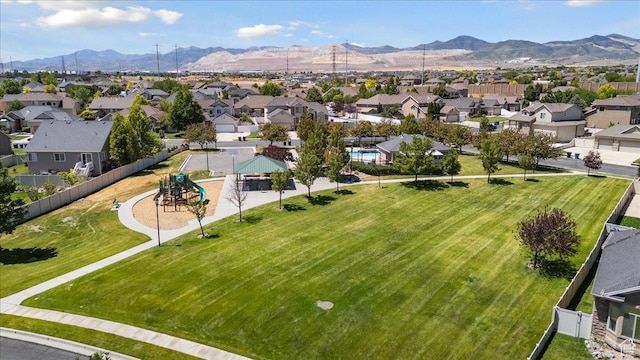5719 W Boulder Creek Rd, West Jordan, UT 84081 - aerial perspective of suburban area featuring a mountainous background and a park