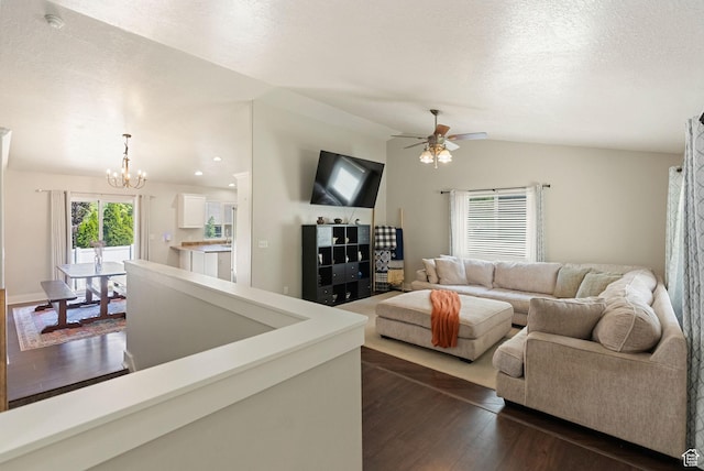151 E 360 N, Providence, UT 84332 - living room featuring a chandelier, dark wood-type flooring, ceiling fan, a textured ceiling, and vaulted ceiling
