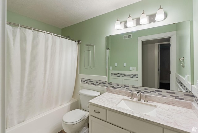 151 E 360 N, Providence, UT 84332 - full bathroom with vanity, shower / bath combo with shower curtain, tile walls, a textured ceiling, and a wainscoted wall