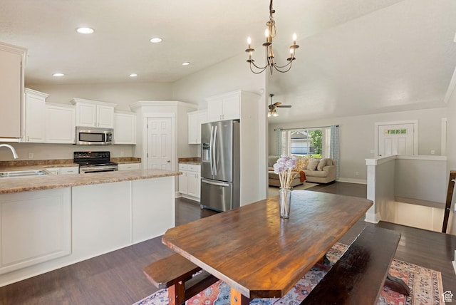 151 E 360 N, Providence, UT 84332 - dining area with vaulted ceiling, dark wood finished floors, recessed lighting, ceiling fan, and a chandelier