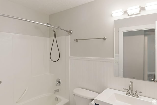 151 E 360 N, Providence, UT 84332 - bathroom featuring a wainscoted wall, vanity, tub / shower combination, and a textured ceiling