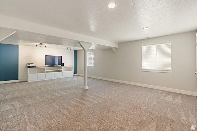 151 E 360 N, Providence, UT 84332 - unfurnished living room featuring a textured ceiling, light colored carpet, and healthy amount of natural light