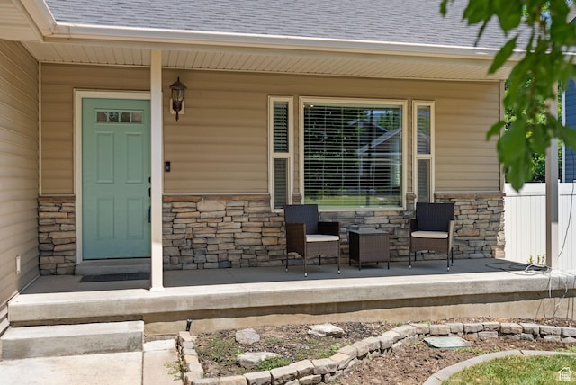 151 E 360 N, Providence, UT 84332 - property entrance featuring stone siding, covered porch, and roof with shingles