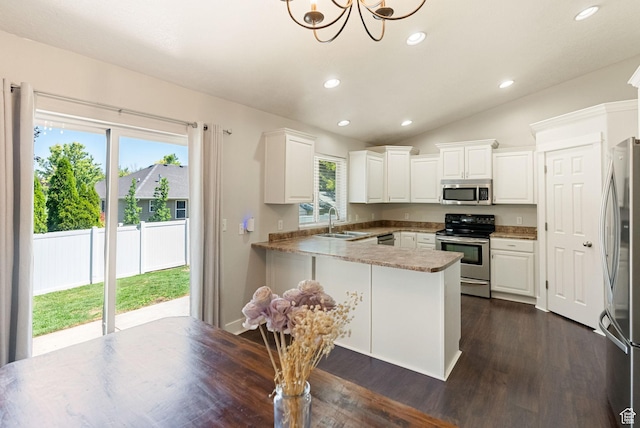 151 E 360 N, Providence, UT 84332 - kitchen with appliances with stainless steel finishes, a peninsula, white cabinets, dark wood-style flooring, and recessed lighting