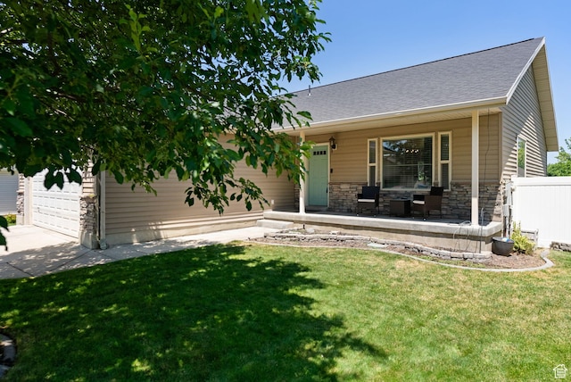 151 E 360 N, Providence, UT 84332 - view of front facade featuring stone siding, covered porch, concrete driveway, roof with shingles, and an attached garage