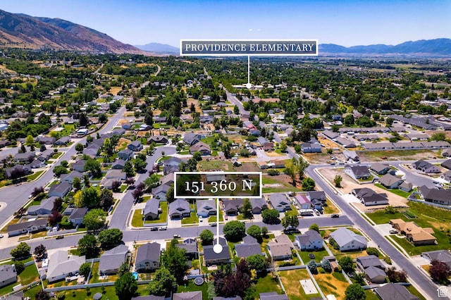 151 E 360 N, Providence, UT 84332 - aerial perspective of suburban area with a mountainous background
