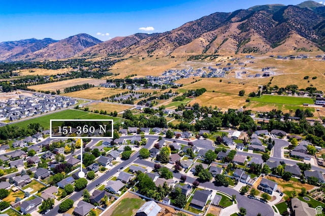 151 E 360 N, Providence, UT 84332 - aerial view of property's location with a mountainous background and property parcel outlined