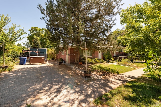 906 E Third Ave, Salt Lake City, UT 84103 - view of property hidden behind natural elements with brick siding
