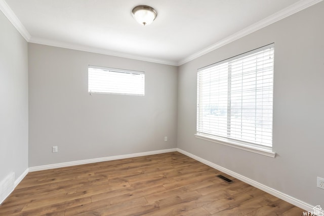 901 S Apple Grove Ln, Pleasant Grove, UT 84062 - spare room with plenty of natural light, wood finished floors, and crown molding